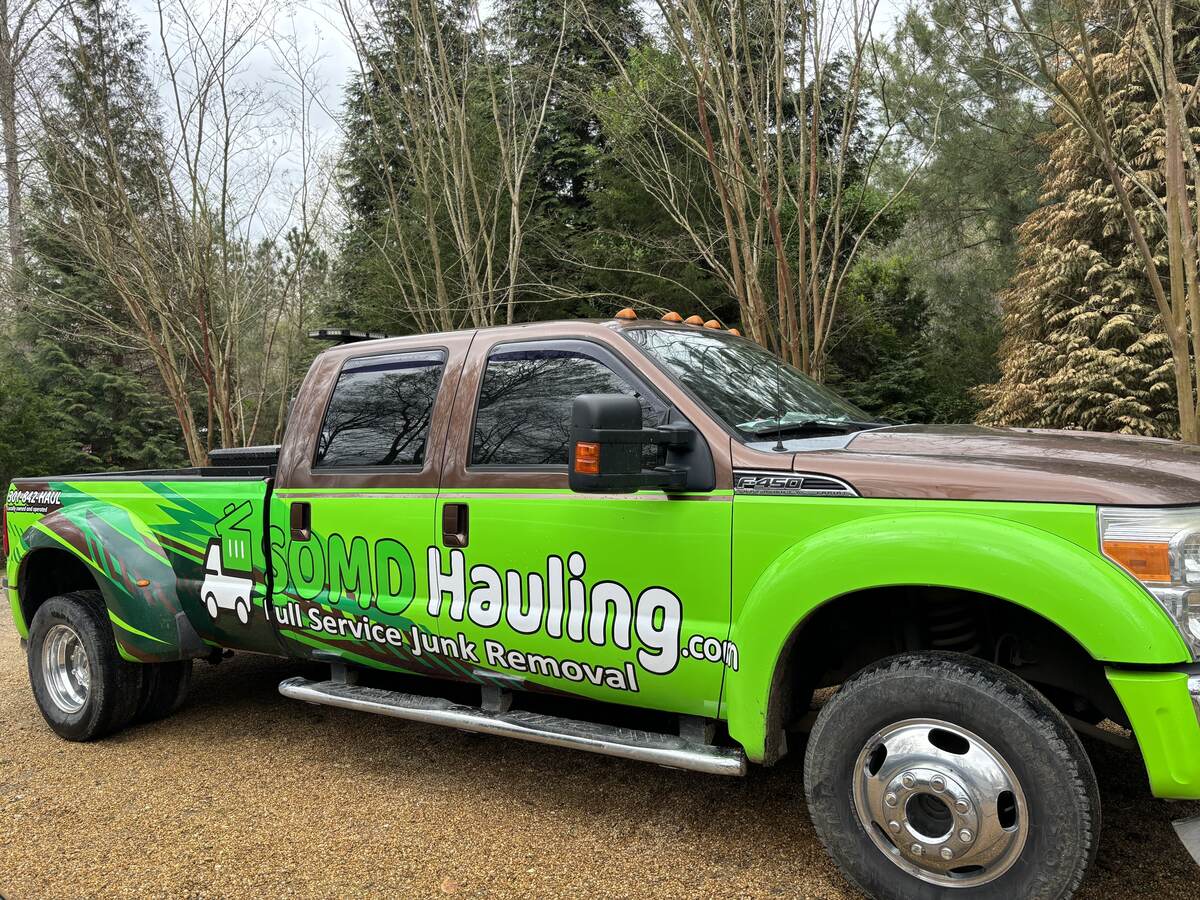 SOMD Hauling F-450 truck with company branding parked on a job site